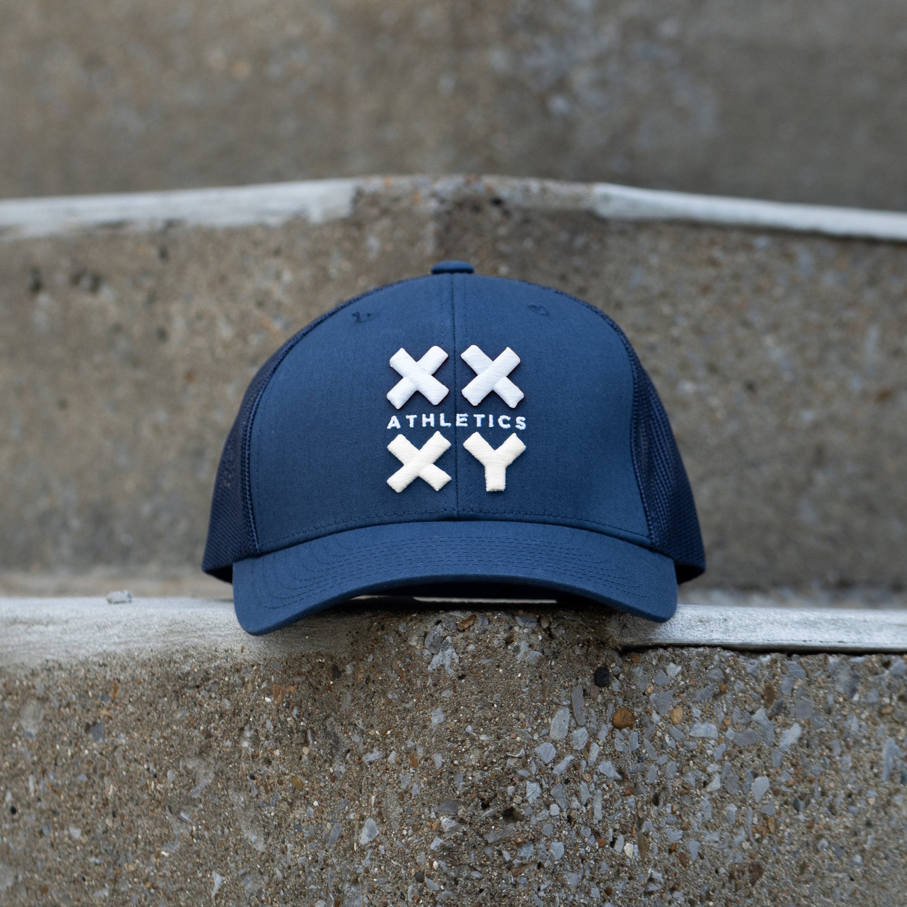 White Logo Trucker Cap on Navy