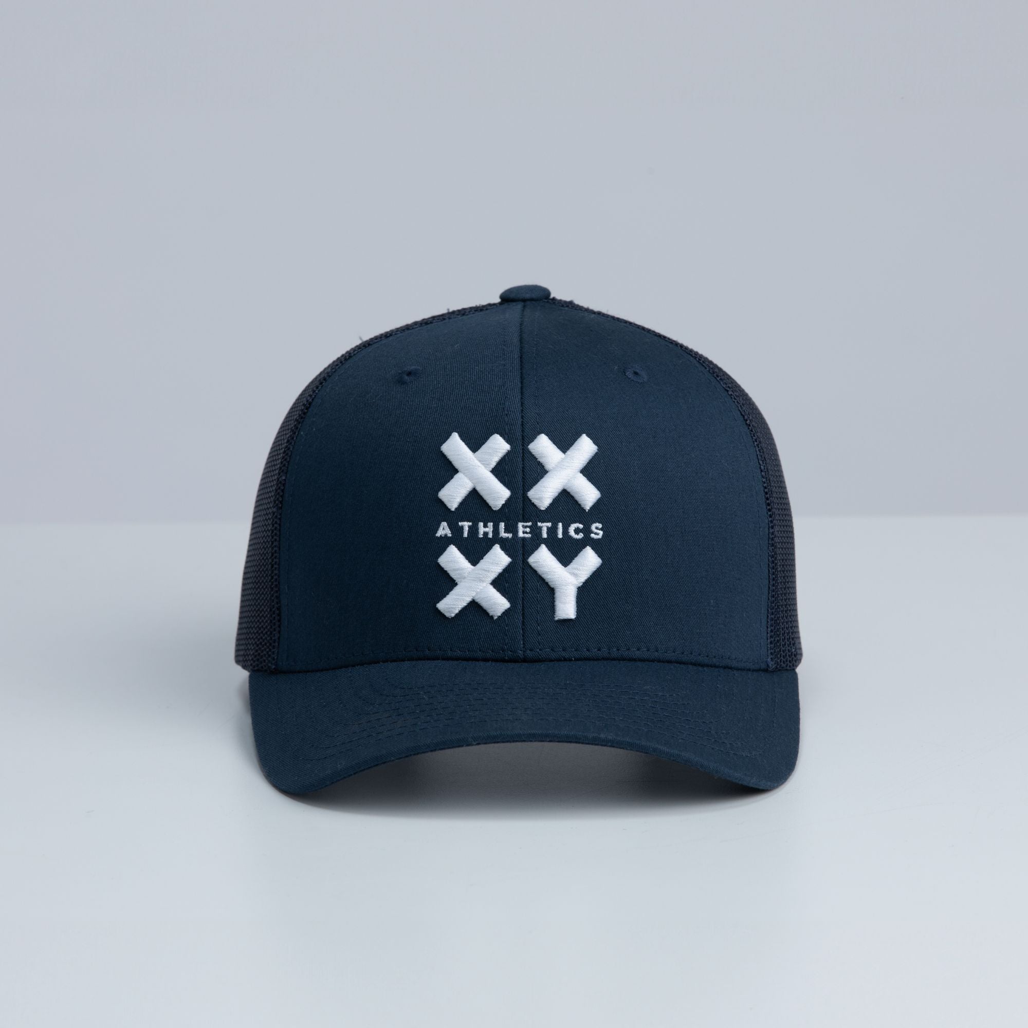 White Logo Trucker Cap on Navy