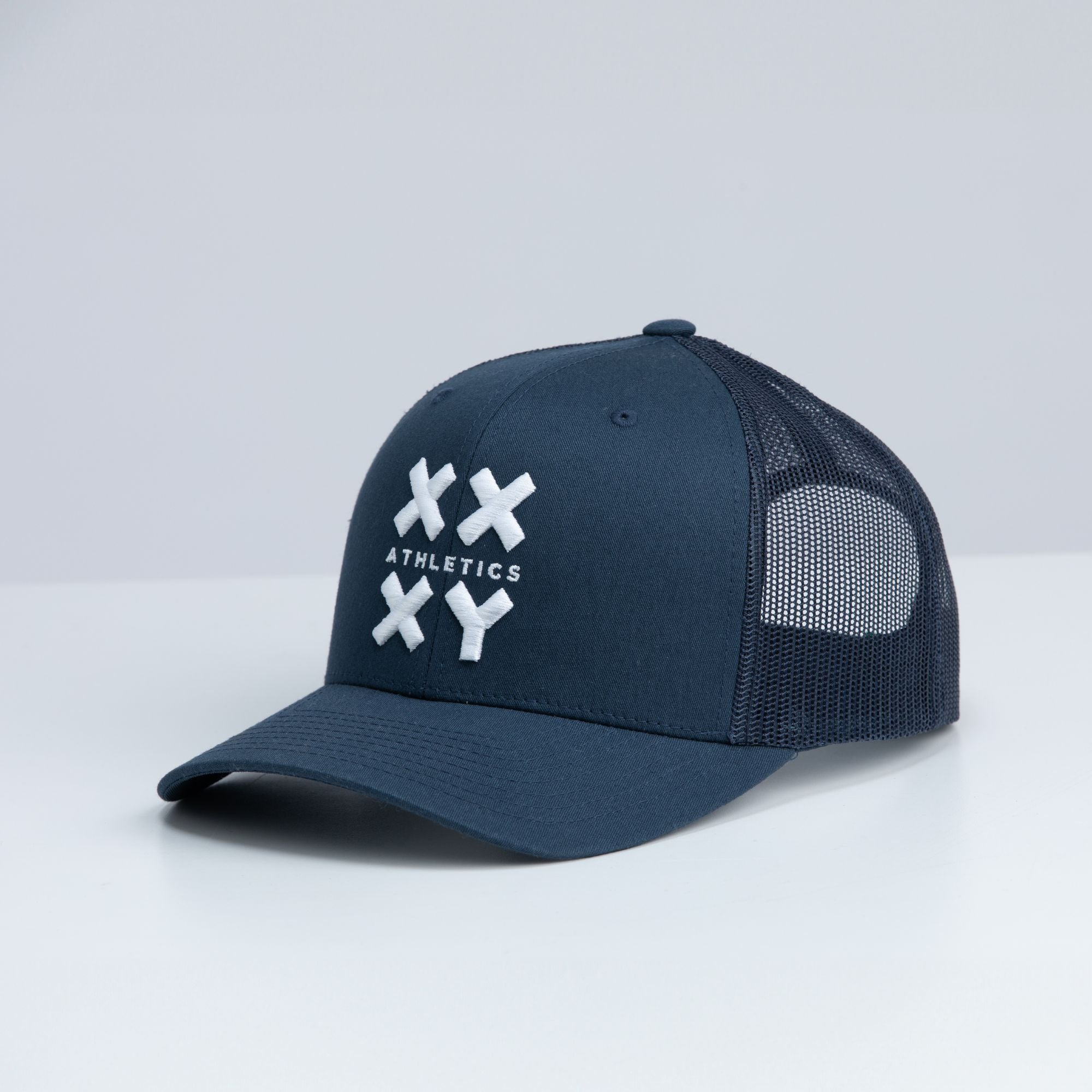 Adjustable White Logo Trucker Cap on Navy with snapback closure